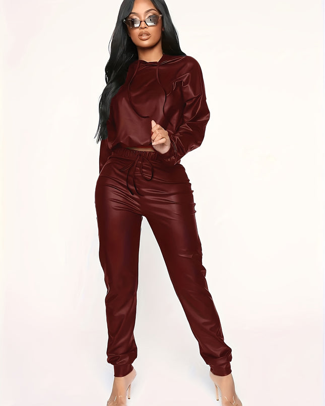 A Two-Piece Set Made of Solid Color Synthetic Faux Leather, Featuring an Off-Shoulder Cropped Hoodie And Drawstring Long Pants, Designed for Women.